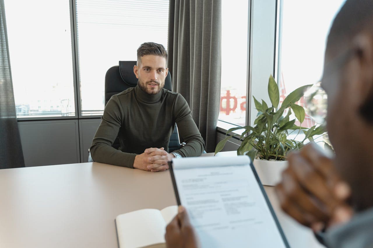 Man sitting in a office conducting an interview